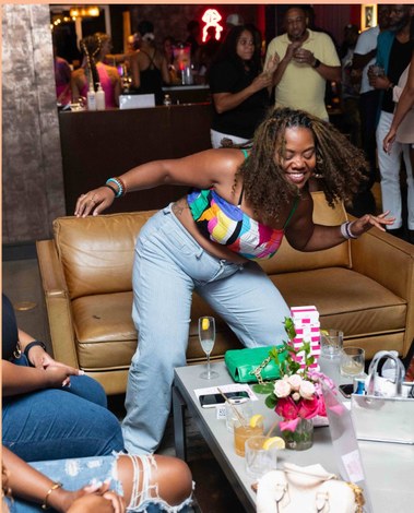 Guest dancing at a late-night wine pop-up lounge